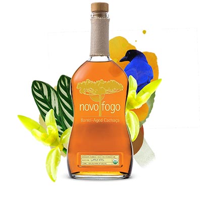 Barrel-aged cachaca with blue bird, leaves and yellow flowers