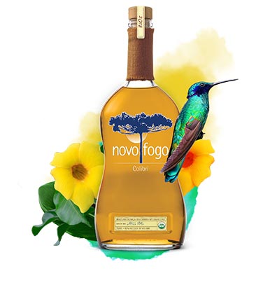 colibri bottle with humming bird, yellow and orange flowers